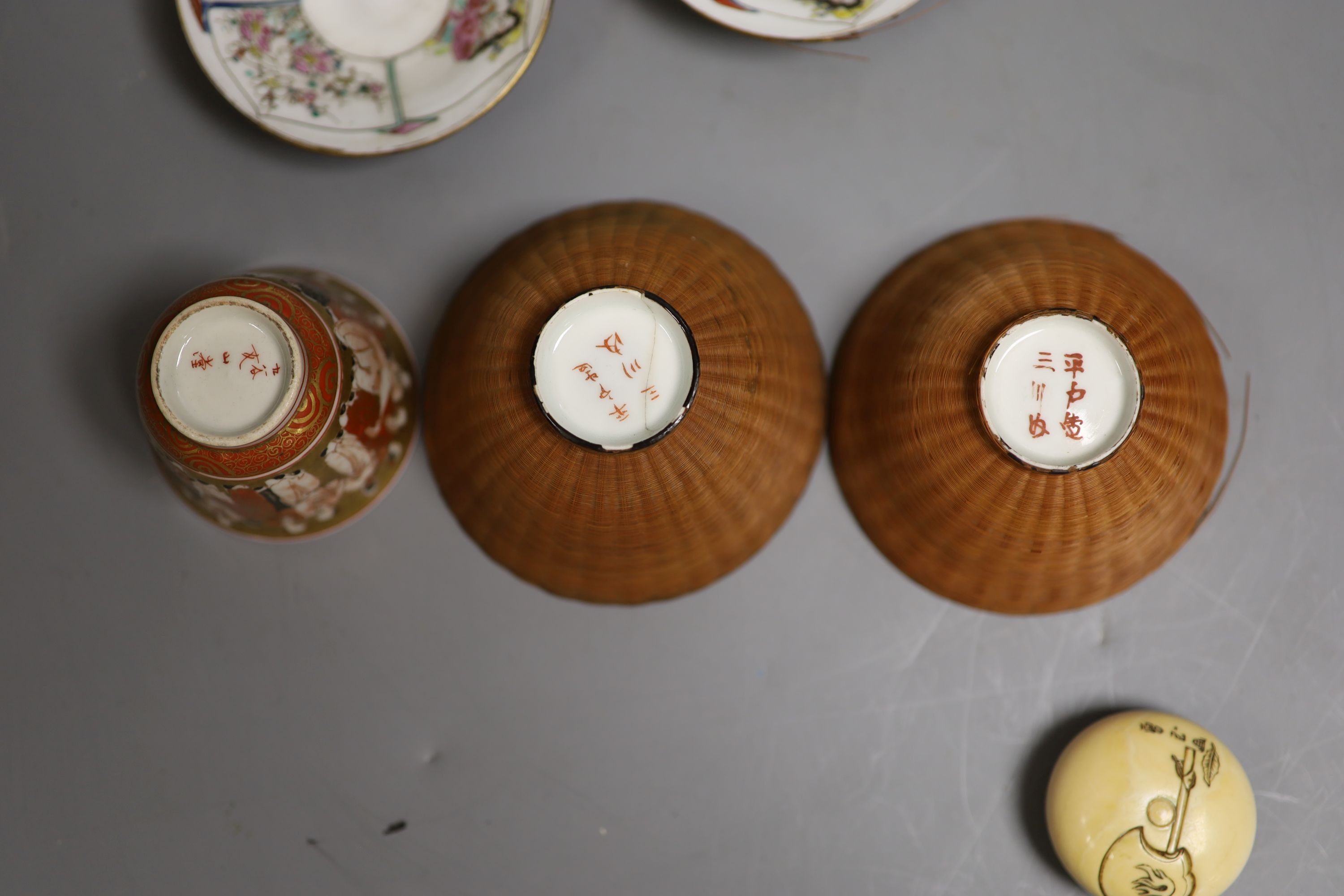 A Japanese ivory manju shaped okimono, three cups & two saucers, all Meiji period.